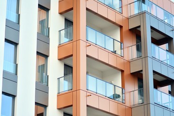 Modern apartment buildings on a sunny day with a blue sky. Facade of a modern apartment building