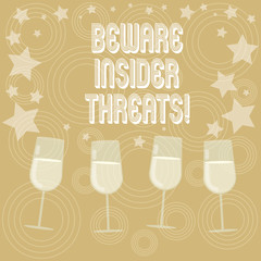 Writing note showing Beware Insider Threats. Business photo showcasing Be cautious on malicious attack inside the network Filled Cocktail Wine Glasses with Scattered Stars as Confetti Stemware