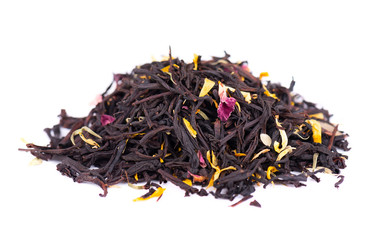 Black ceylon tea with rose petals, cornflowers, sunflower and almond slices, isolated on white background.