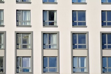 Modern apartment buildings on a sunny day with a blue sky. Facade of a modern apartment building