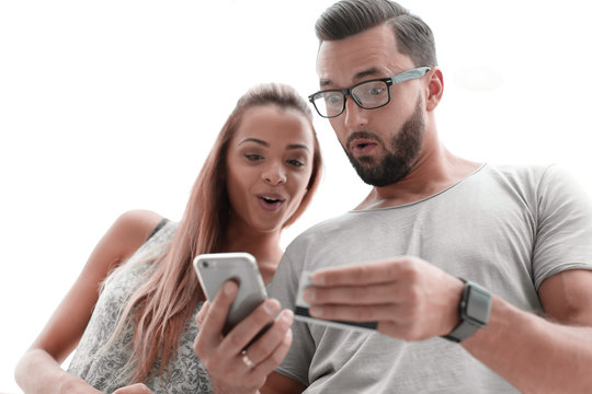 Young Couple Doing Online Shopping With Smartphone