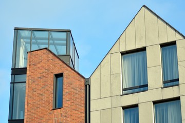 Modern apartment buildings on a sunny day with a blue sky. Facade of a modern apartment building