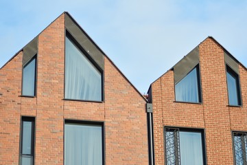 Modern apartment buildings on a sunny day with a blue sky. Facade of a modern apartment building