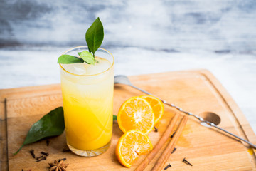 Fresh cocktail with mandarines on the rustic background. Selective focus. Shallow depth of field.