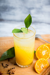 Fresh cocktail with mandarines on the rustic background. Selective focus. Shallow depth of field.