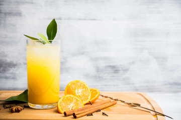 Fresh cocktail with mandarines on the rustic background. Selective focus. Shallow depth of field.