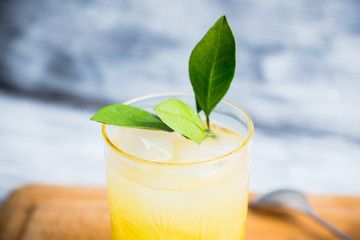 Fresh cocktail with mandarines on the rustic background. Selective focus. Shallow depth of field.