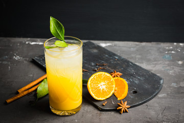 Fresh cocktail with mandarines on the rustic background. Selective focus. Shallow depth of field.