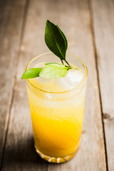 Fresh cocktail with mandarines on the rustic background. Selective focus. Shallow depth of field.