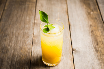 Fresh cocktail with mandarines on the rustic background. Selective focus. Shallow depth of field.