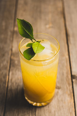 Fresh cocktail with mandarines on the rustic background. Selective focus. Shallow depth of field.