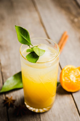 Fresh cocktail with mandarines on the rustic background. Selective focus. Shallow depth of field.