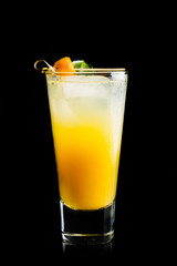 Fresh cocktail with mandarines on black background. Selective focus. Shallow depth of field. 