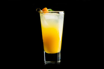 Fresh cocktail with mandarines on black background. Selective focus. Shallow depth of field. 