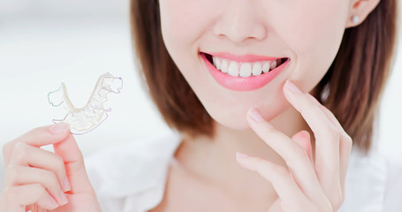 woman with retainer for teeth