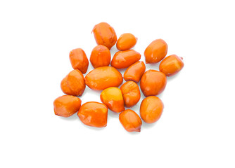 Roasted salted peanuts isolated on a white background, top view