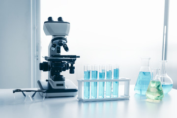 Laboratory microscope of healthcare and medicine researcher scientist with lab equipment tools on the table., Science technology analysis instrument, Working space for research in science laboratory..