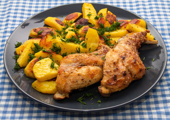 ham rabbit with potatoes cooked in the oven lies on a plate