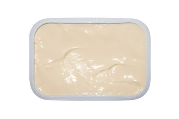 Processed cheese in a package.Cream cheese in an open package on a white background.