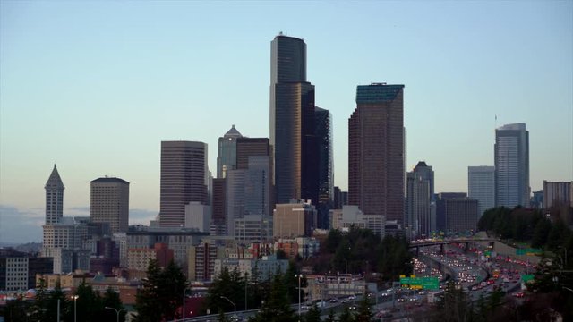 UHD 4K time lapse video of Downtown Seattle with busy traffic on freeway during sunset in Seattle Washington 3840x2160 Ultra High Definition