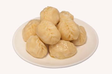 manti dumplings ravioli great big huge on a plate close-up menu for the cafe restaurant isolated white background