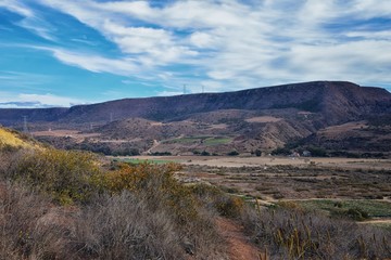 Obraz premium La Mision Valley landscapes and Beach in Mexico on the West Coast a small canyon near the Pacific Ocean that houses the Door of Faith and Buena Vida Orphanage, South of Tijuana, Mexico. 