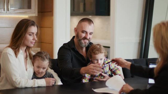 Family signing a lease agreement for their new home / Buying a home 