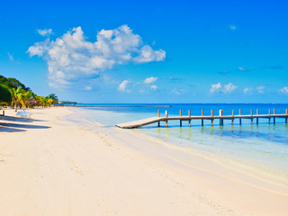 Caribbean beach with a pier