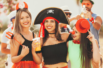 Brazilian Carnival. Group of Brazilian people in costume celebrating the carnival party in the city