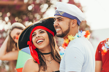Brazilian Carnival. Couple in costume enjoying the carnival party in the city