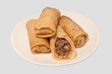 Traditional Russian Fried Stuffed Pancakes Blintzes with Meat.