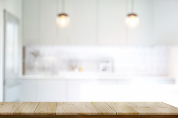 Empty wooden top table or cutting counter table in modern kitchen room background. For product or food montage