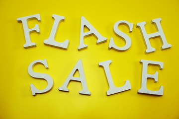 Flash Sale alphabet letters on yellow background business concept
