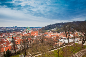 Obraz premium Petrin hill and the beautiful Prague city old town seen form the Prague Castle viewpoint in an early spring day