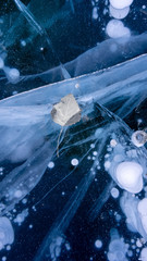 The frozen lake surface, showing a variety of textures. Blue background of Ice texture. 