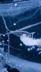 The frozen lake surface, showing a variety of textures. Blue background of Ice texture. 