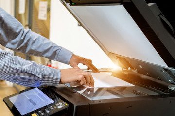 Business man Hand press button on panel of printer, printer scanner laser office copy machine...