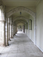 Columns and arches of an undercover walkway in a church