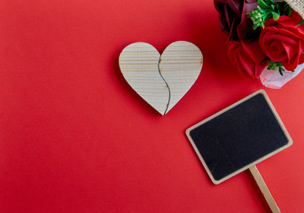 Fototapeta premium Valentines day wooden heart on red background