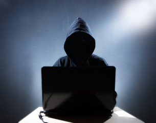 a hacker works on a computer
