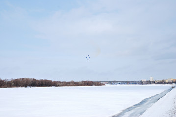 Performance of aerobatic team Russian Knights at the air show..Omsk, Russia - 19 March, 2016: Performance of Russian Knights at the air show..