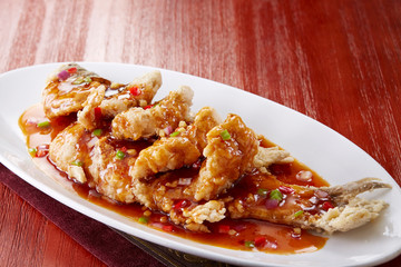 Delicious Chinese food, fried fish in sweet and sour sauce