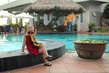 child by the pool