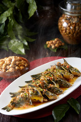 Delicious Chinese food, steamed yellow front fish with yellow peel fruit
