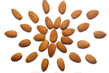Pattern of Nuts - peeled almonds on a white background in the form of a circle. Concepts about decoration, healthy eating and food background.