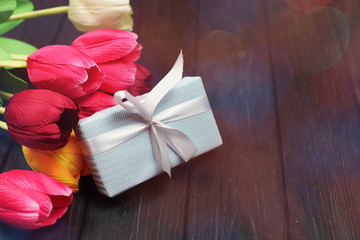 blue gift box with bow surprise wooden background 