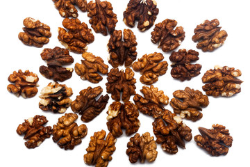 Obraz premium Pattern of Walnuts - peeled walnut on a white background in the form of a circle. Concepts about decoration, healthy eating and food background.