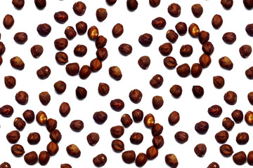 Walnut pattern - hazelnuts on a white background in the form of a circle. Concepts about decoration, healthy eating and food background.