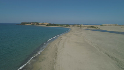 Aerial view of beautiful beach, lagoons. Philippines, Luzon, Ilocos Norte. Coast ocean with turquoise water. Tropical landscape in Asia.