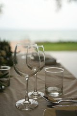 Dining set on the white table sheet with white bouquet flower background